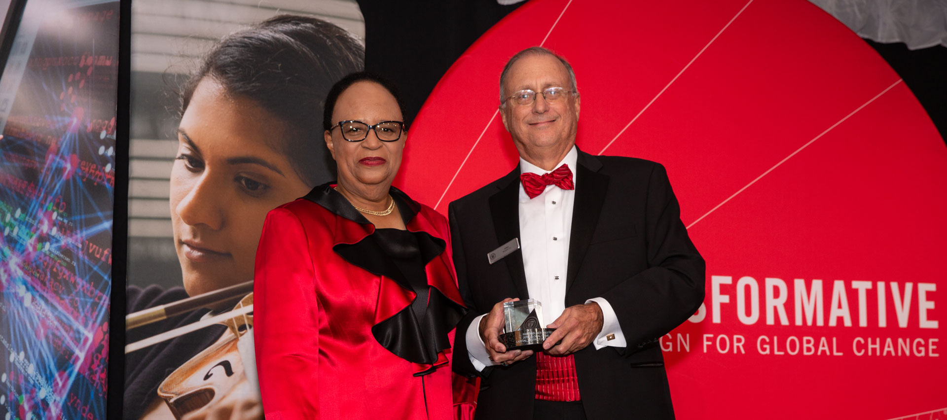 Dr. John D. Bennett ’74, CDPHP president, and CEO, receives the Global Game Changers award from Dr. Shirley Ann Jackson at 2019 Scholarship Gala.