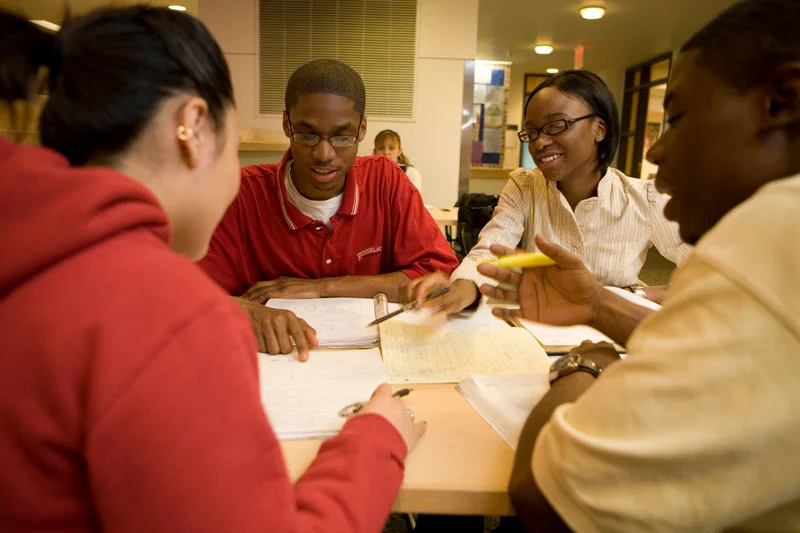 Students sitting around a table studying